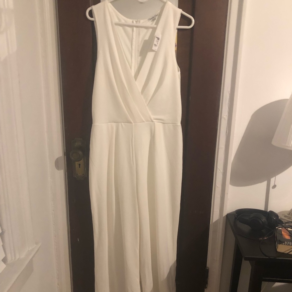 White jump suit with plunge neck